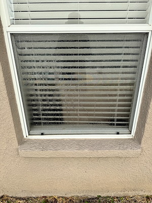 Dirty window frame before cleaning