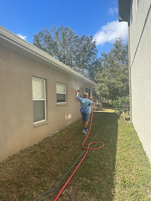 House washing technician softwashing siding
